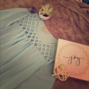 Gorgeous turquoise blouse with lace details